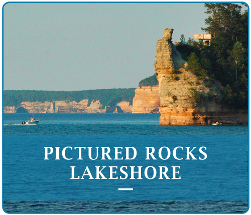 The Pictured Rocks Lakeshore have been naturally sculptured by wind, waves and rain into caves, arches, formations that resemble castle turrets, and human profiles, among others. 