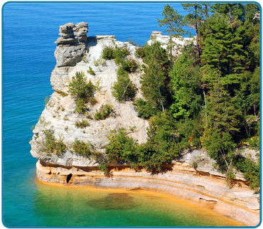 Miners Castle is located 6 1/2 miles east of Munising on Alger County Road H58.  