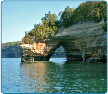 This tour highlight is an imposing arch of rock that extends from the shoreline out to an outcropping located directly in Lake Superior.